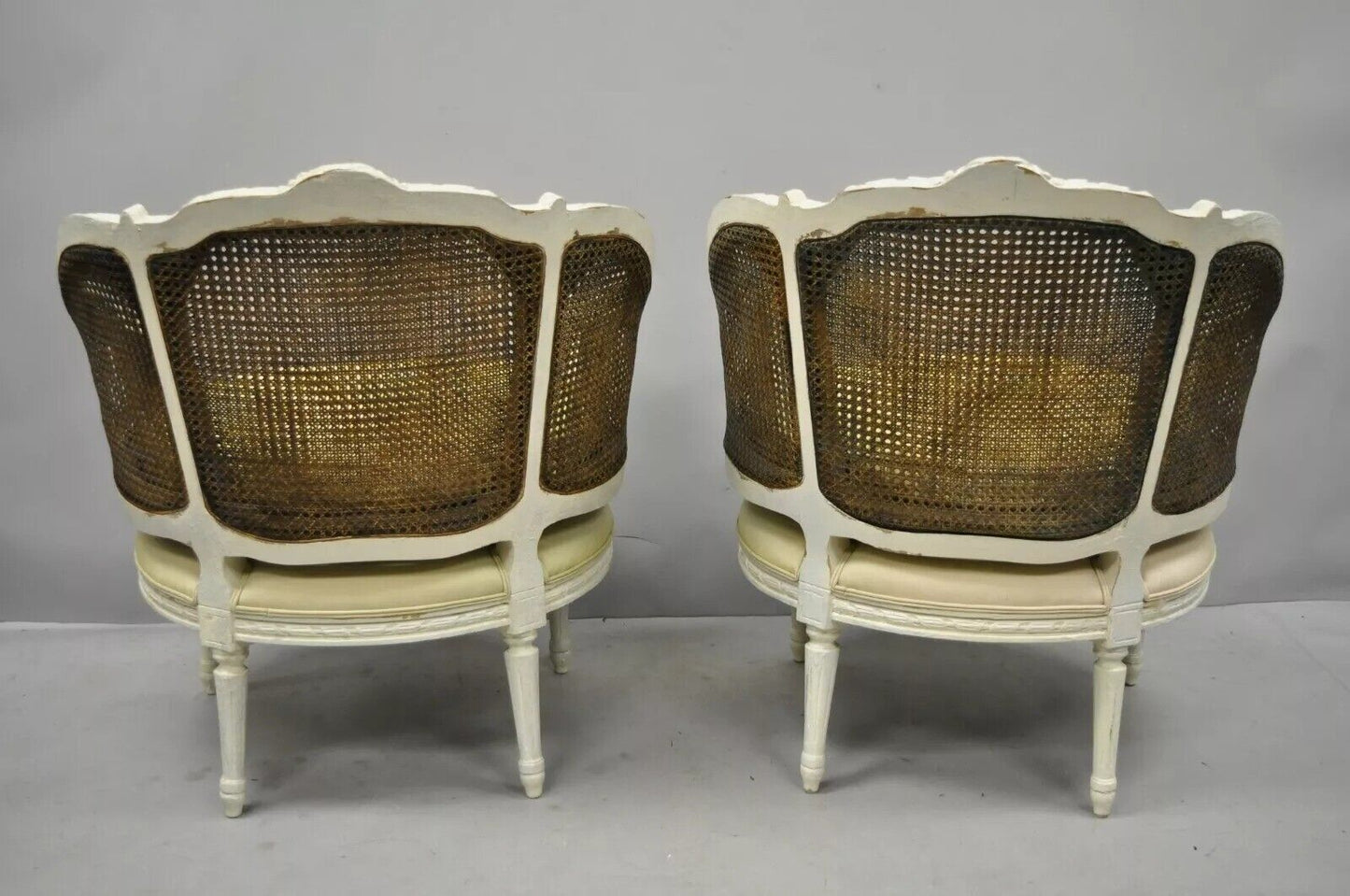 French Louis XVI Style White Distress Painted Cane Bergere Club Chairs - a Pair