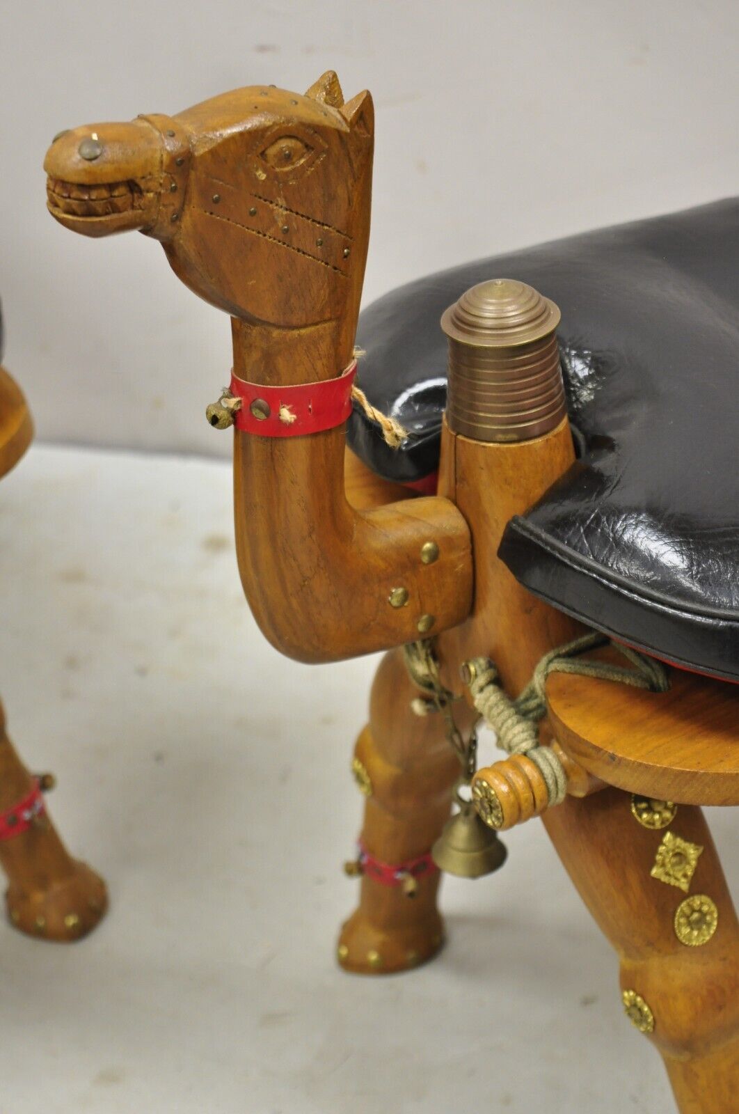 Vintage Camel Saddle Stools Carved Wood Black/Red Cushions - a Pair