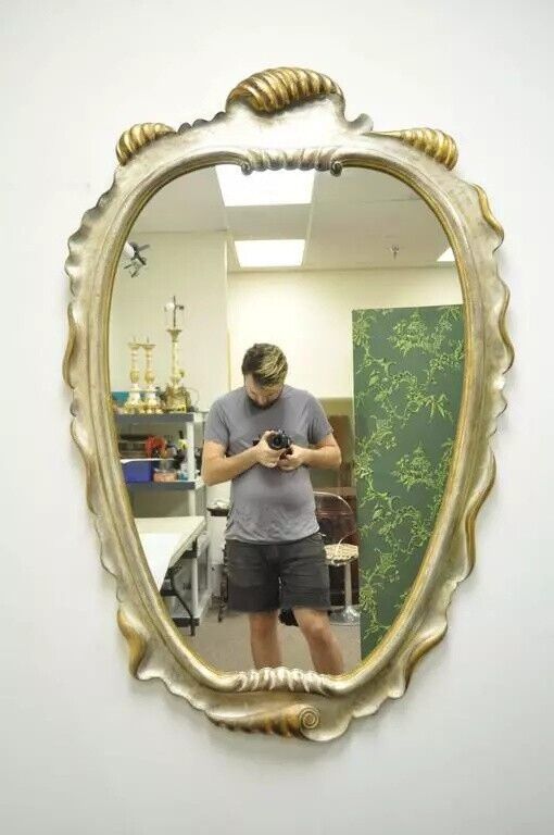 Italian Hollywood Regency Gold and Silver Giltwood Scroll Carved Wall Mirror
