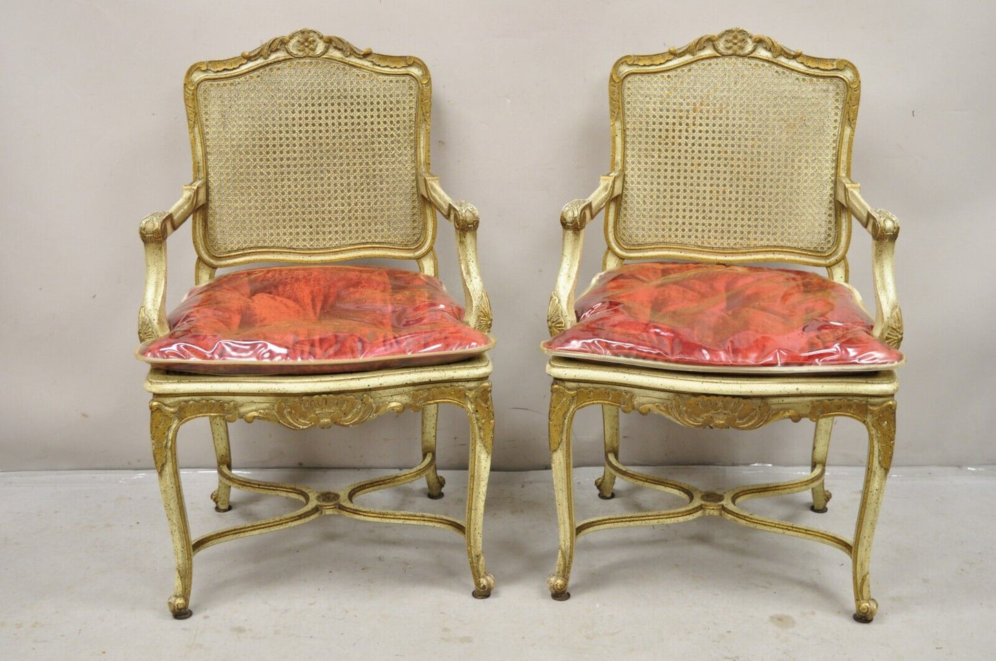 French Louis XV Style Cream Painted Carved Wood Cane Fauteuil Arm Chairs - Pair