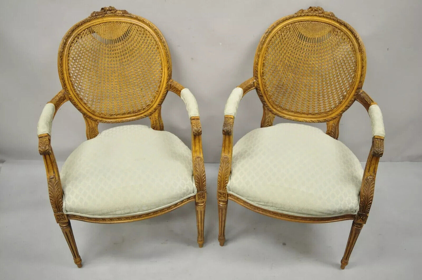 Vintage French Country Louis XVI Style Oval Cane Back Walnut Arm Chairs - a Pair