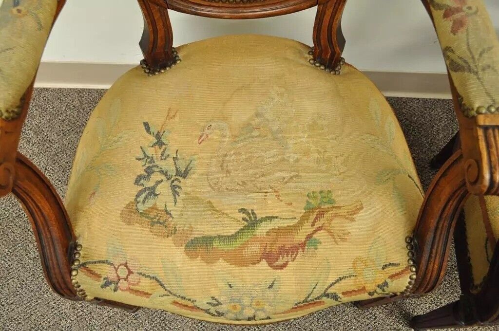 19th C. French Louis XVI Style Carved Walnut Needlepoint Arm Chairs - a Pair