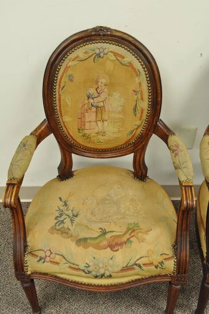 19th C. French Louis XVI Style Carved Walnut Needlepoint Arm Chairs - a Pair