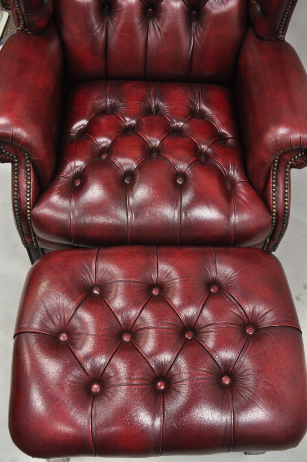 English Chesterfield Oxblood Burgundy Leather Tufted Wingback Chair and Ottoman