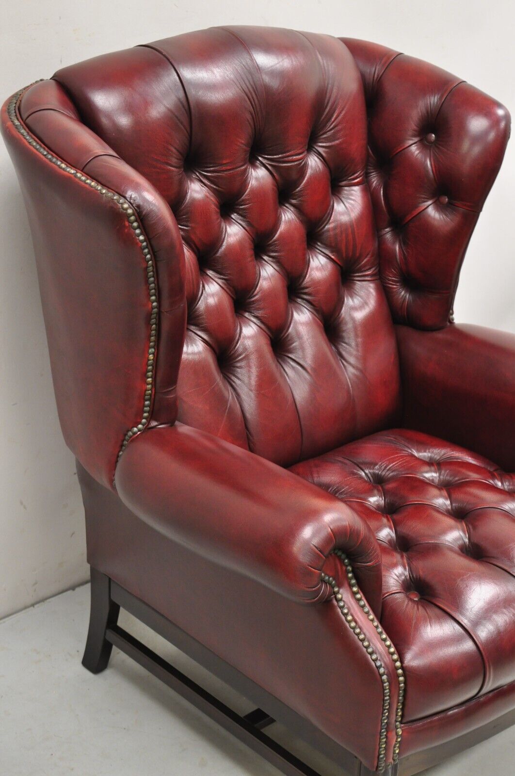 English Chesterfield Oxblood Burgundy Leather Tufted Wingback Chair and Ottoman
