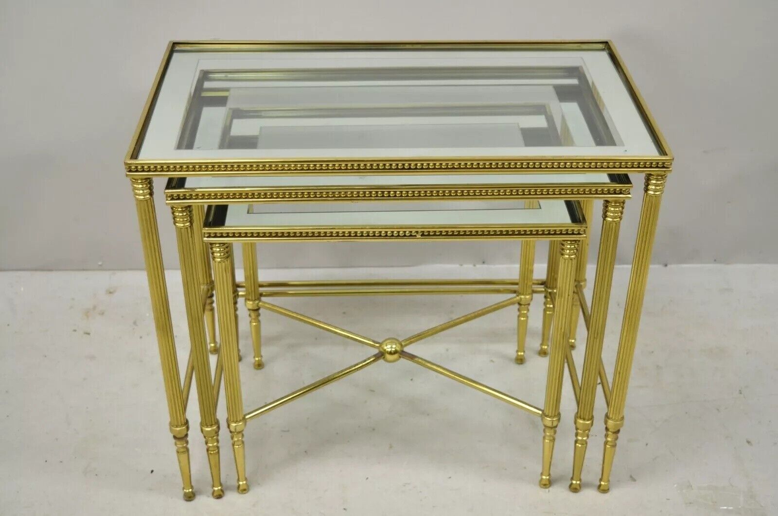 Italian Hollywood Regency Brass Mirror Glass Top Nesting Side Tables - Set 3