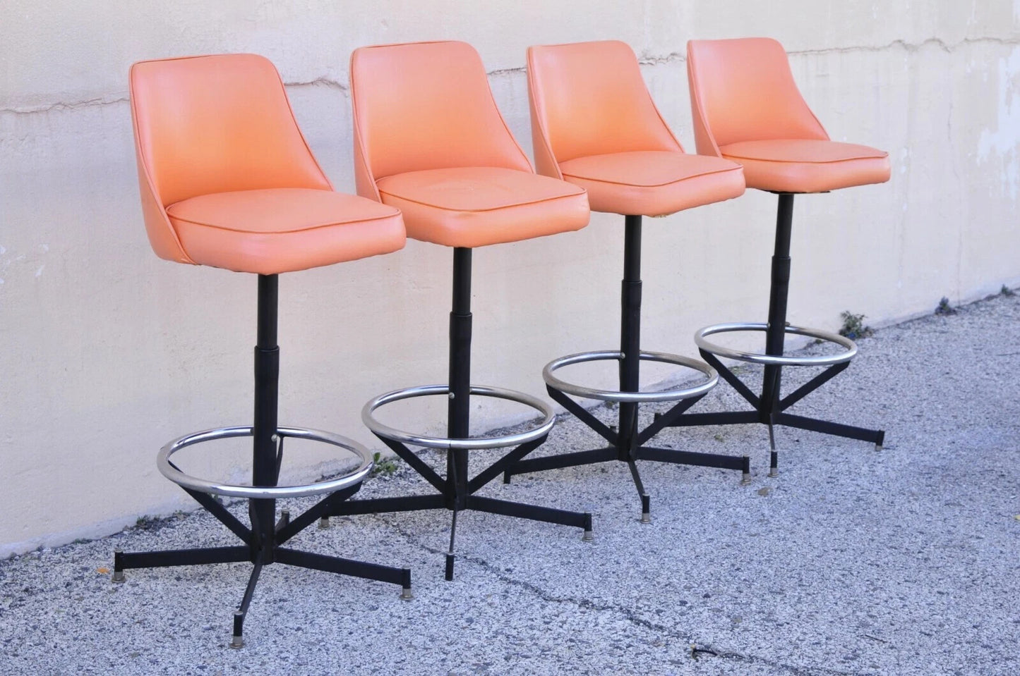 Vintage Mid Century Modern Atomic Orange Vinyl Metal Swivel Barstools - Set of 4