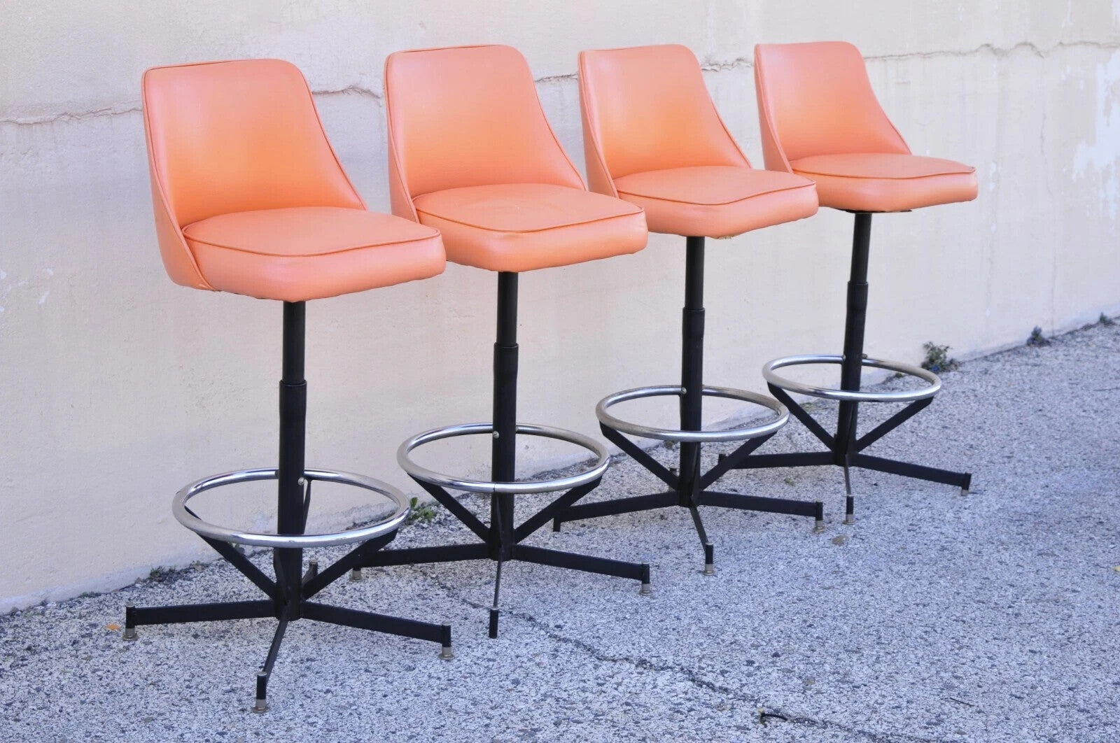 Vintage Mid Century Modern Atomic Orange Vinyl Metal Swivel Barstools - Set of 4
