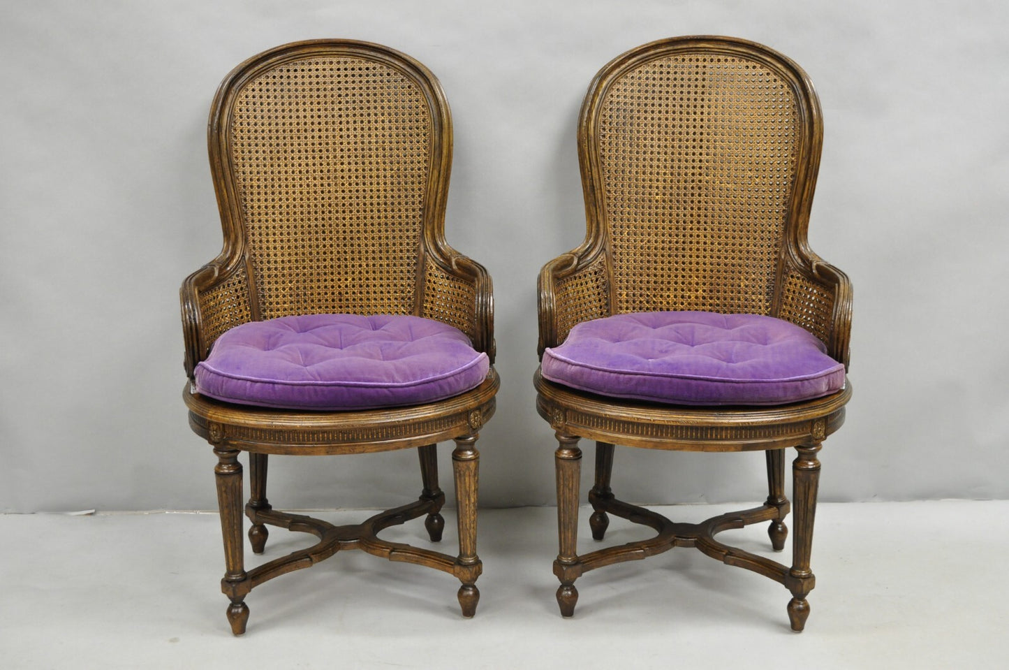 Vintage French Louis XVI Style Cane Balloon Back Walnut Arm Chairs - a Pair