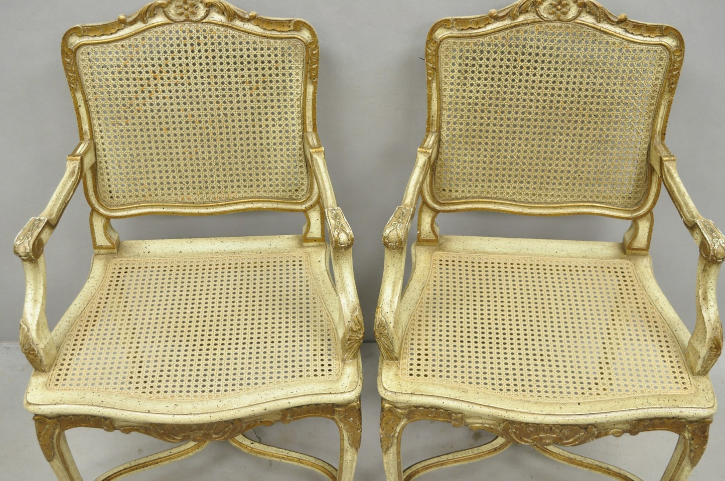 Vintage French Louis XV Style Cream Painted Carved Wood Cane Arm Chairs - a Pair