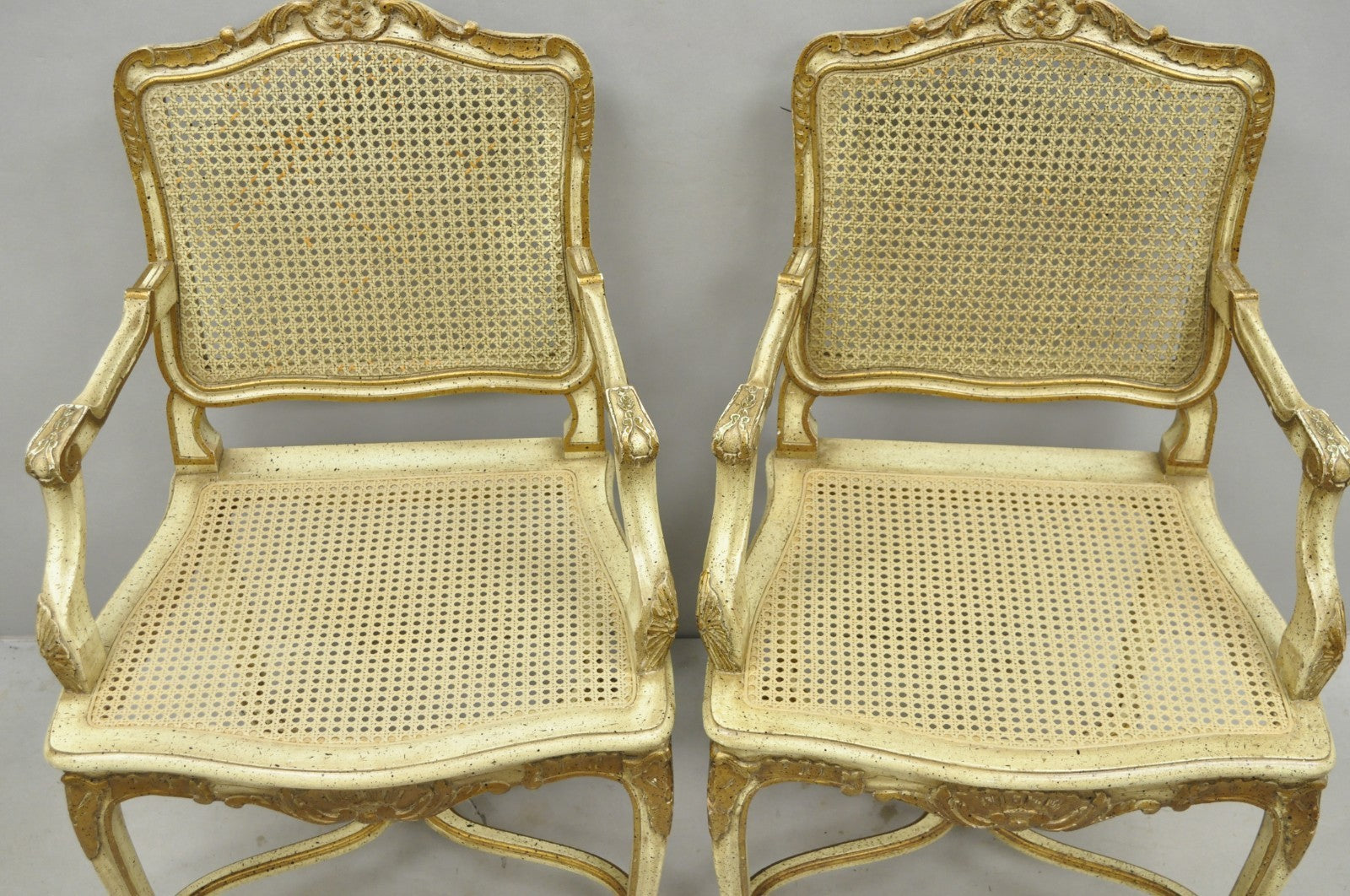 Vintage French Louis XV Style Cream Painted Carved Wood Cane Arm Chairs - a Pair