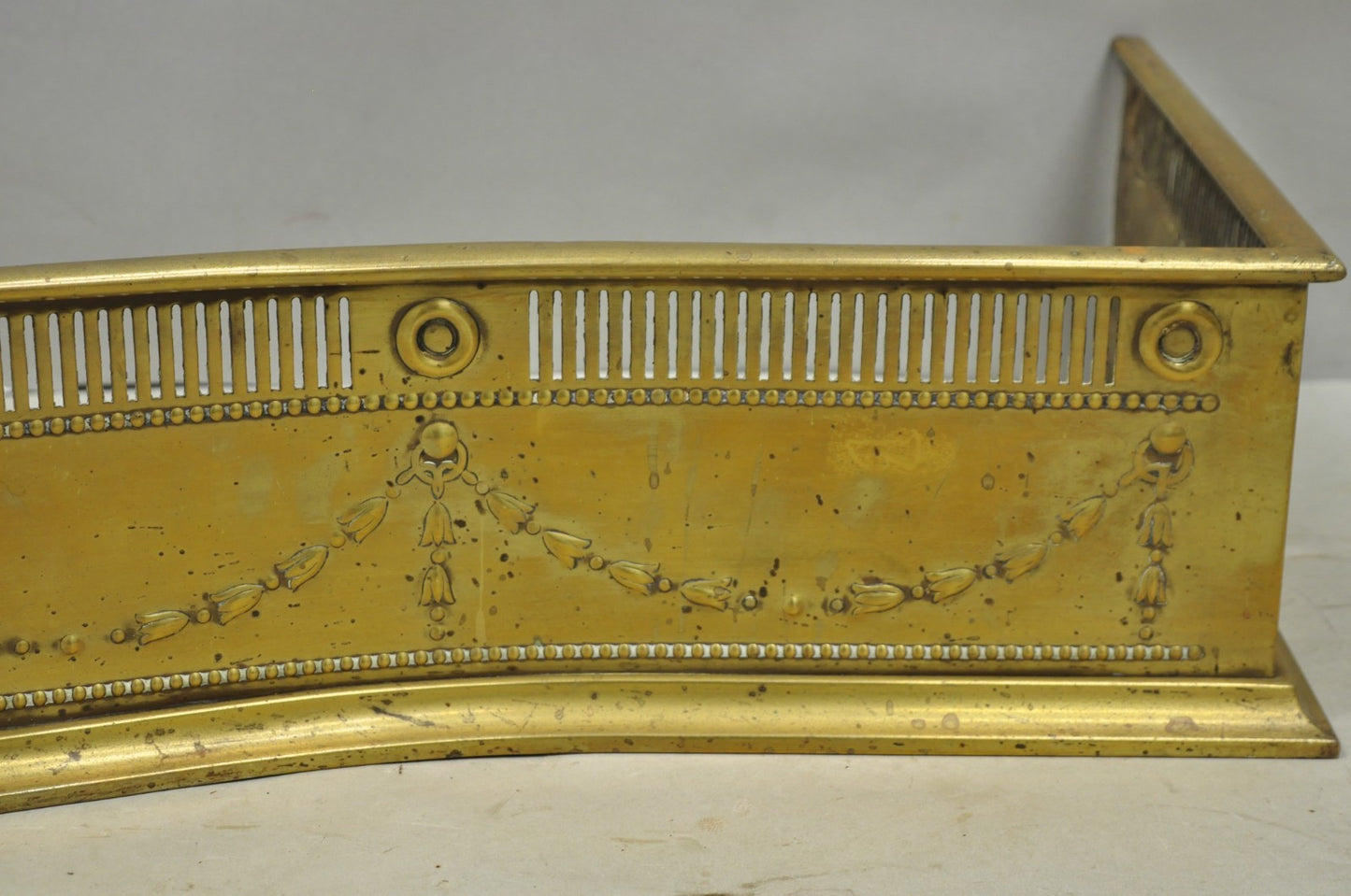 Antique English Victorian Serpentine Drape & Bellflower Brass Fireplace Fender