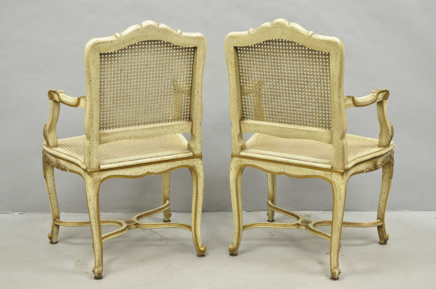 Vintage French Louis XV Style Cream Painted Carved Wood Cane Arm Chairs - a Pair