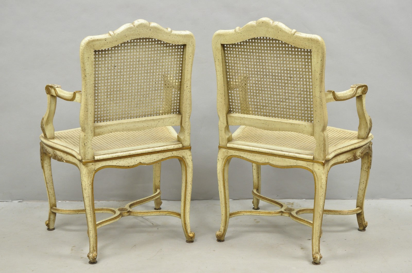 Vintage French Louis XV Style Cream Painted Carved Wood Cane Arm Chairs - a Pair