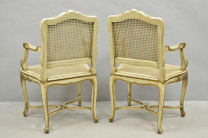 Vintage French Louis XV Style Cream Painted Carved Wood Cane Arm Chairs - a Pair