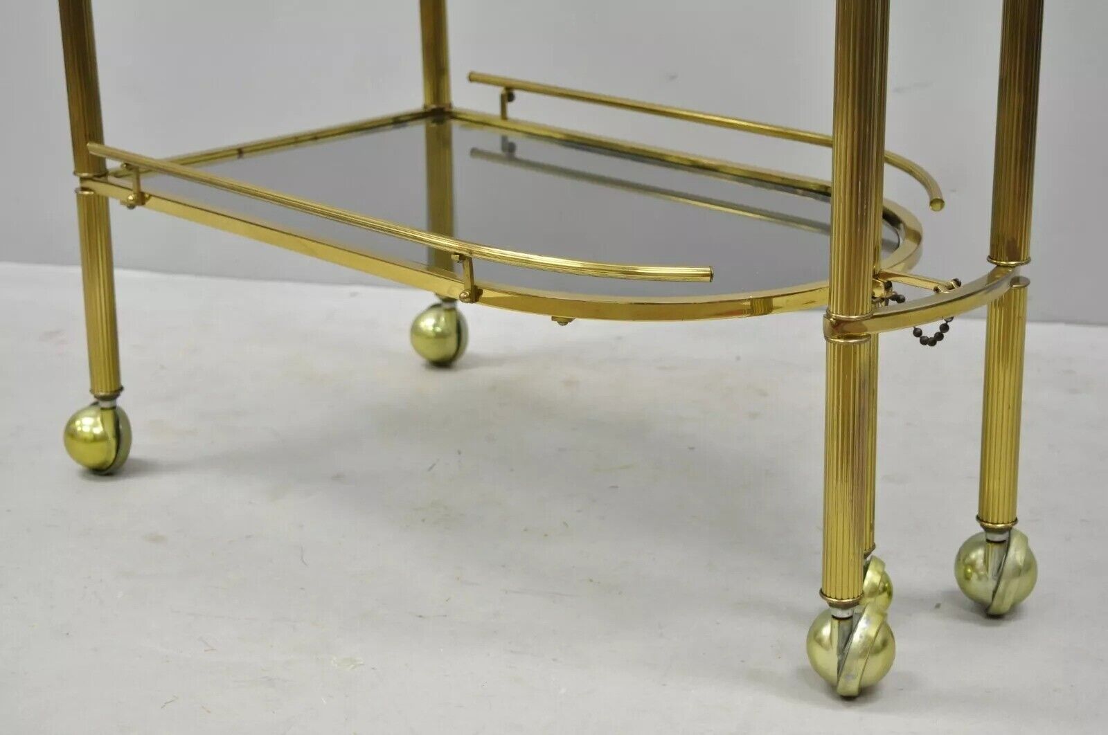 Italian Hollywood Regency Brass Swivel Rolling Bar Cart Server with Smoked Glass