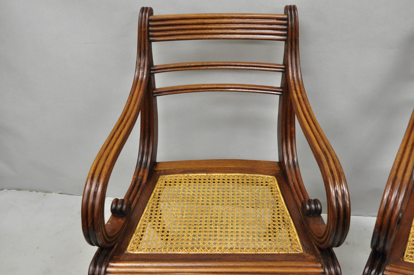 Vintage English Regency Style Cane Seat Mahogany Saber Leg Arm Chairs - a Pair