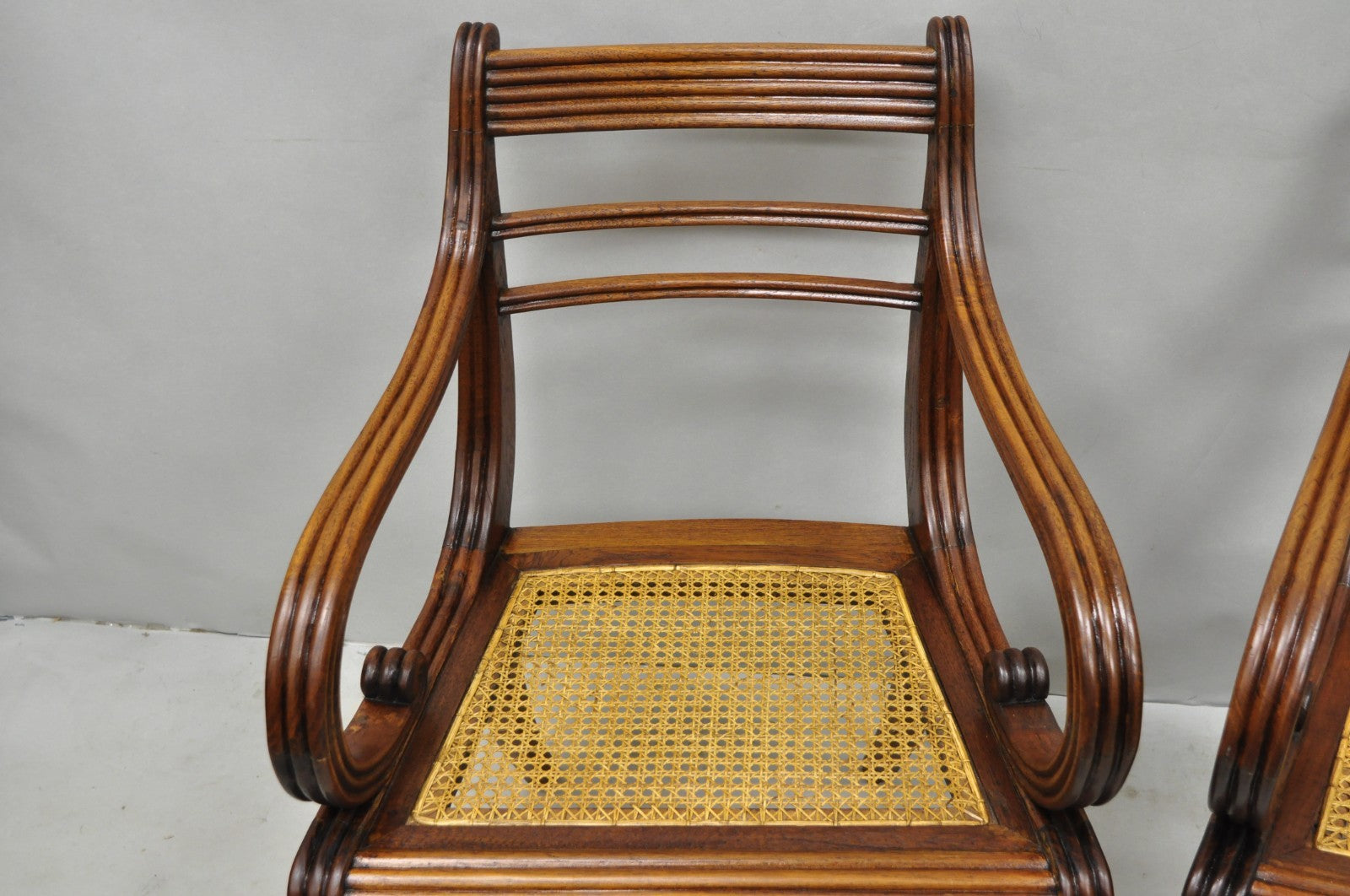 Vintage English Regency Style Cane Seat Mahogany Saber Leg Arm Chairs - a Pair