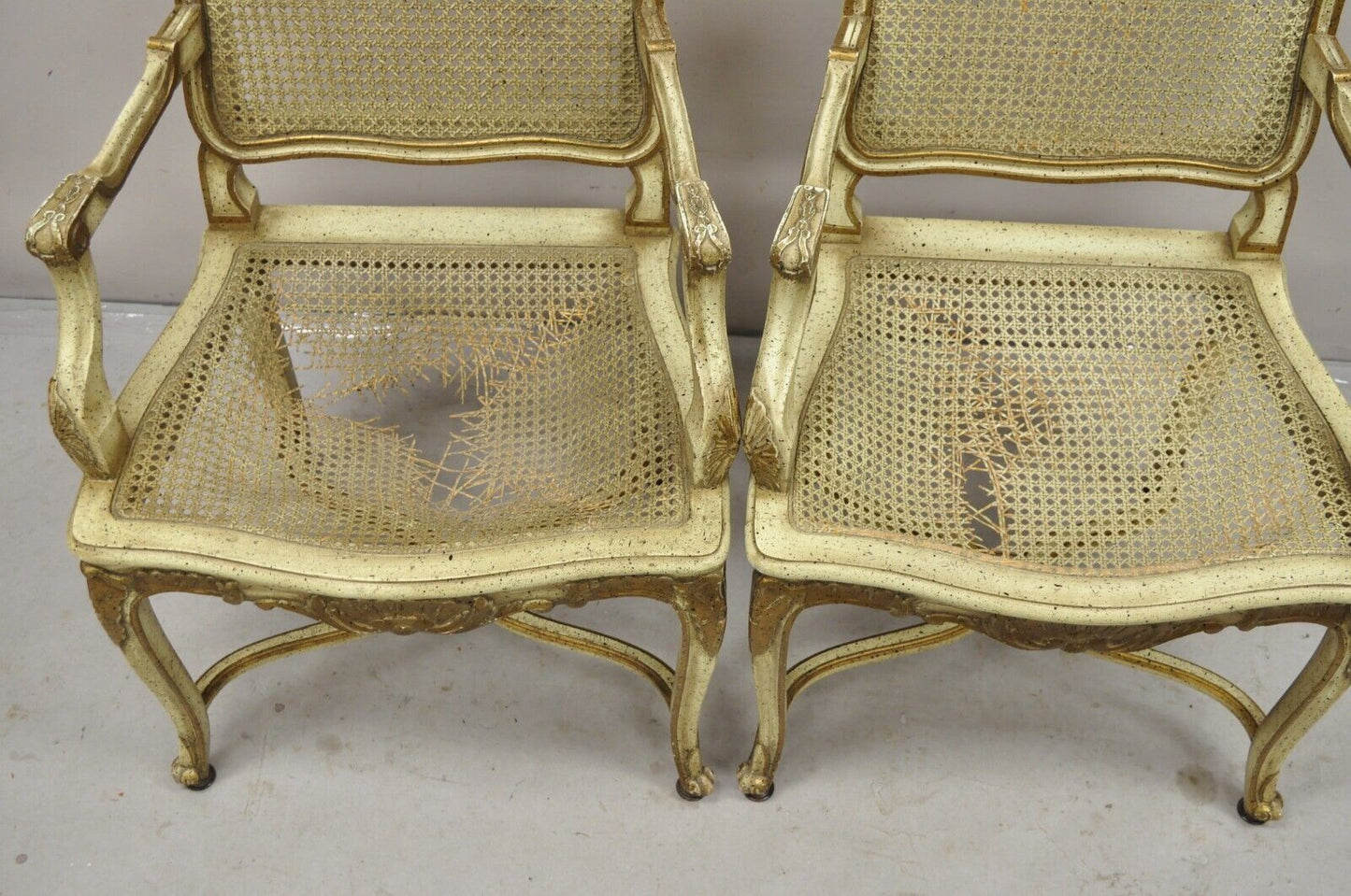 French Louis XV Style Cream Painted Carved Wood Cane Fauteuil Arm Chairs - Pair