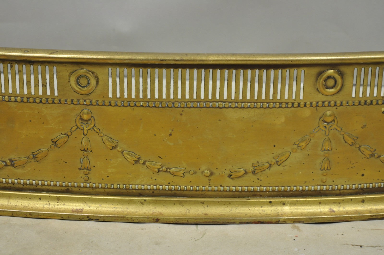 Antique English Victorian Serpentine Drape & Bellflower Brass Fireplace Fender