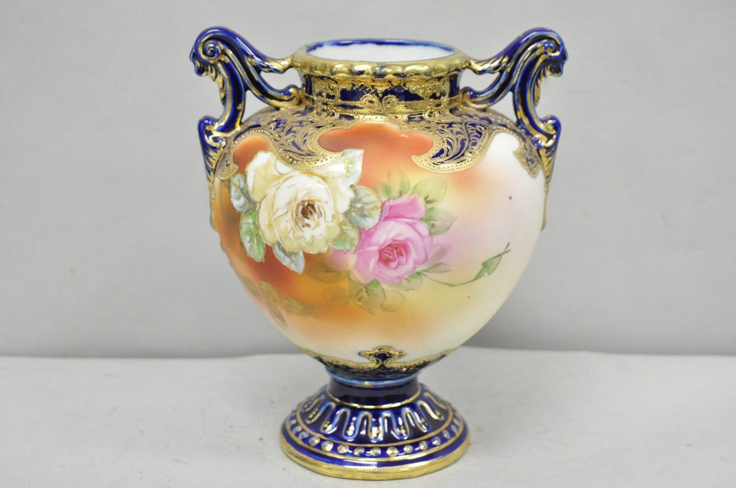 Antique Nippon Hand Painted Floral Design Cobalt Blue Porcelain Bolted Urn Vase