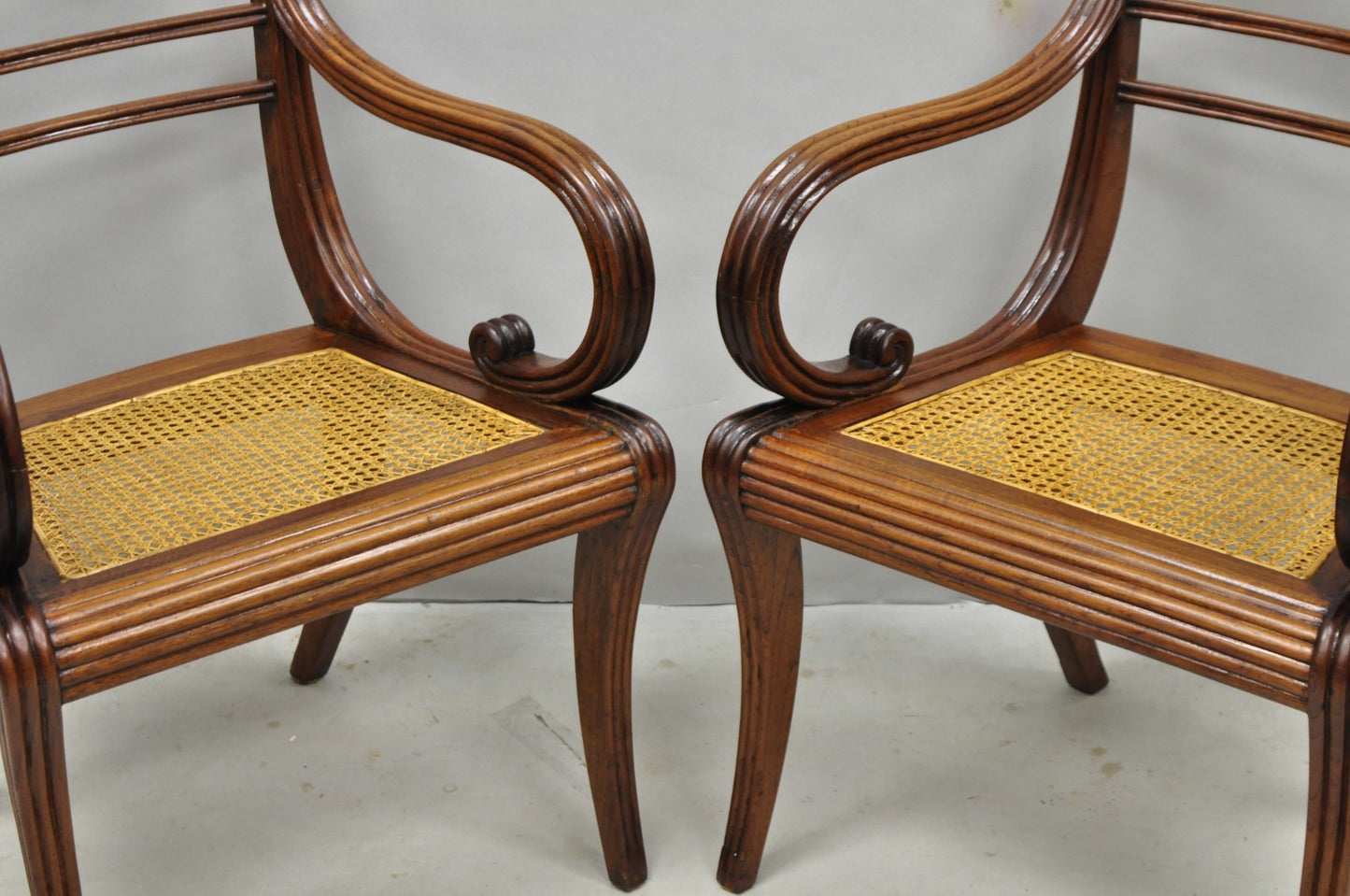 Vintage English Regency Style Cane Seat Mahogany Saber Leg Arm Chairs - a Pair