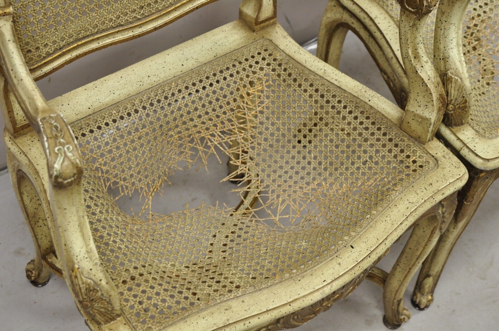 French Louis XV Style Cream Painted Carved Wood Cane Fauteuil Arm Chairs - Pair
