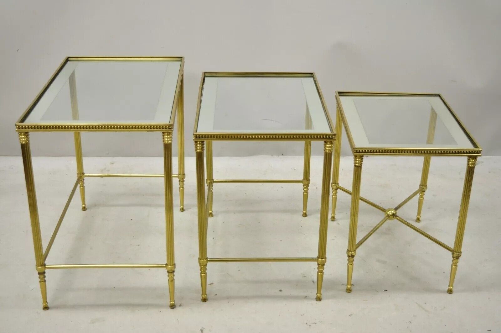 Italian Hollywood Regency Brass Mirror Glass Top Nesting Side Tables - Set 3