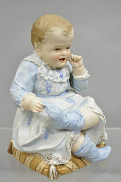 Antique Bisque Porcelain Seated Baby Figurine in Circular Glass Display Cloche