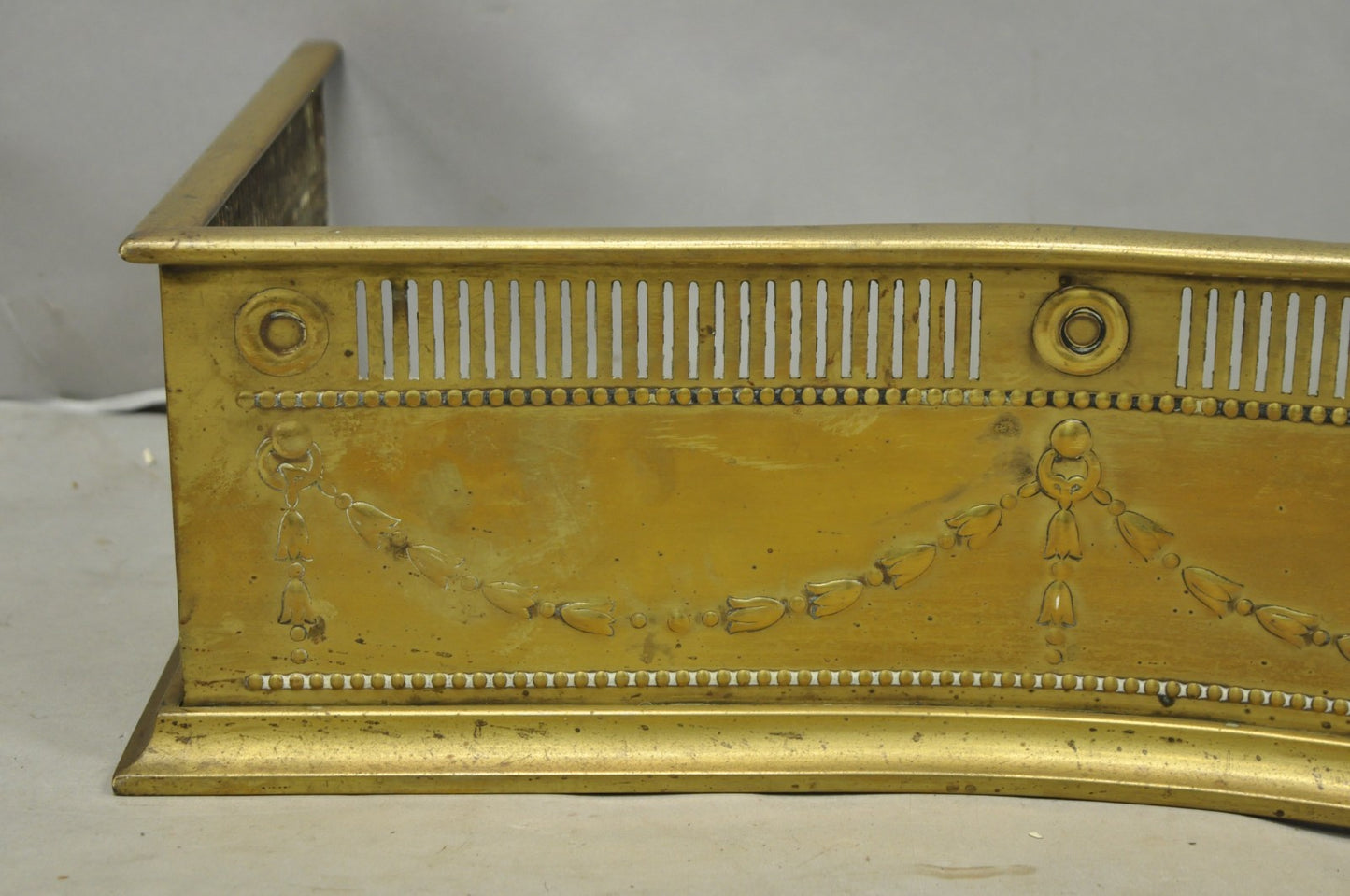 Antique English Victorian Serpentine Drape & Bellflower Brass Fireplace Fender