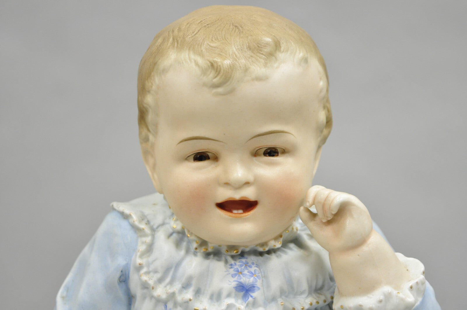Antique Bisque Porcelain Seated Baby Figurine in Circular Glass Display Cloche