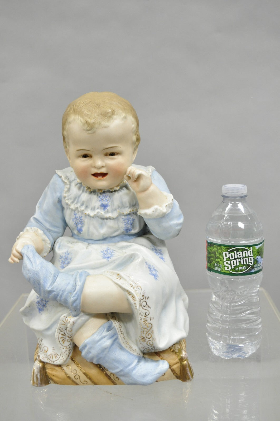 Antique Bisque Porcelain Seated Baby Figurine in Circular Glass Display Cloche