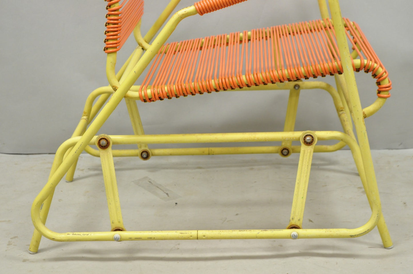 Vintage Mid Century Modern Orange Vinyl Spaghetti Strap Glider Lounge Chair