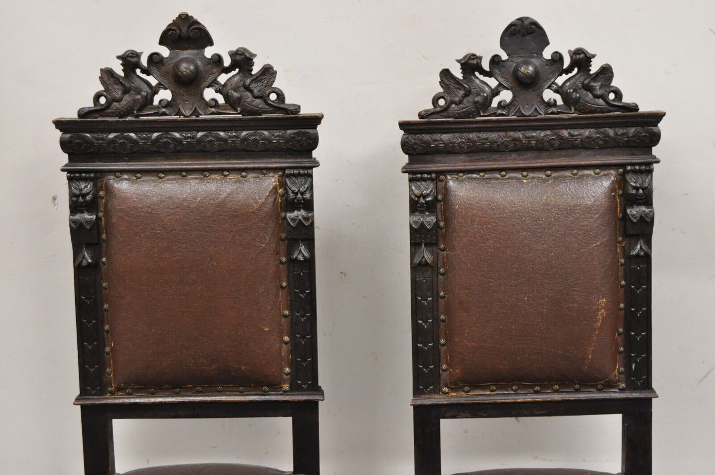 Antique Spanish Renaissance Carved Oak Wood Figural Leather Side Chairs - a Pair