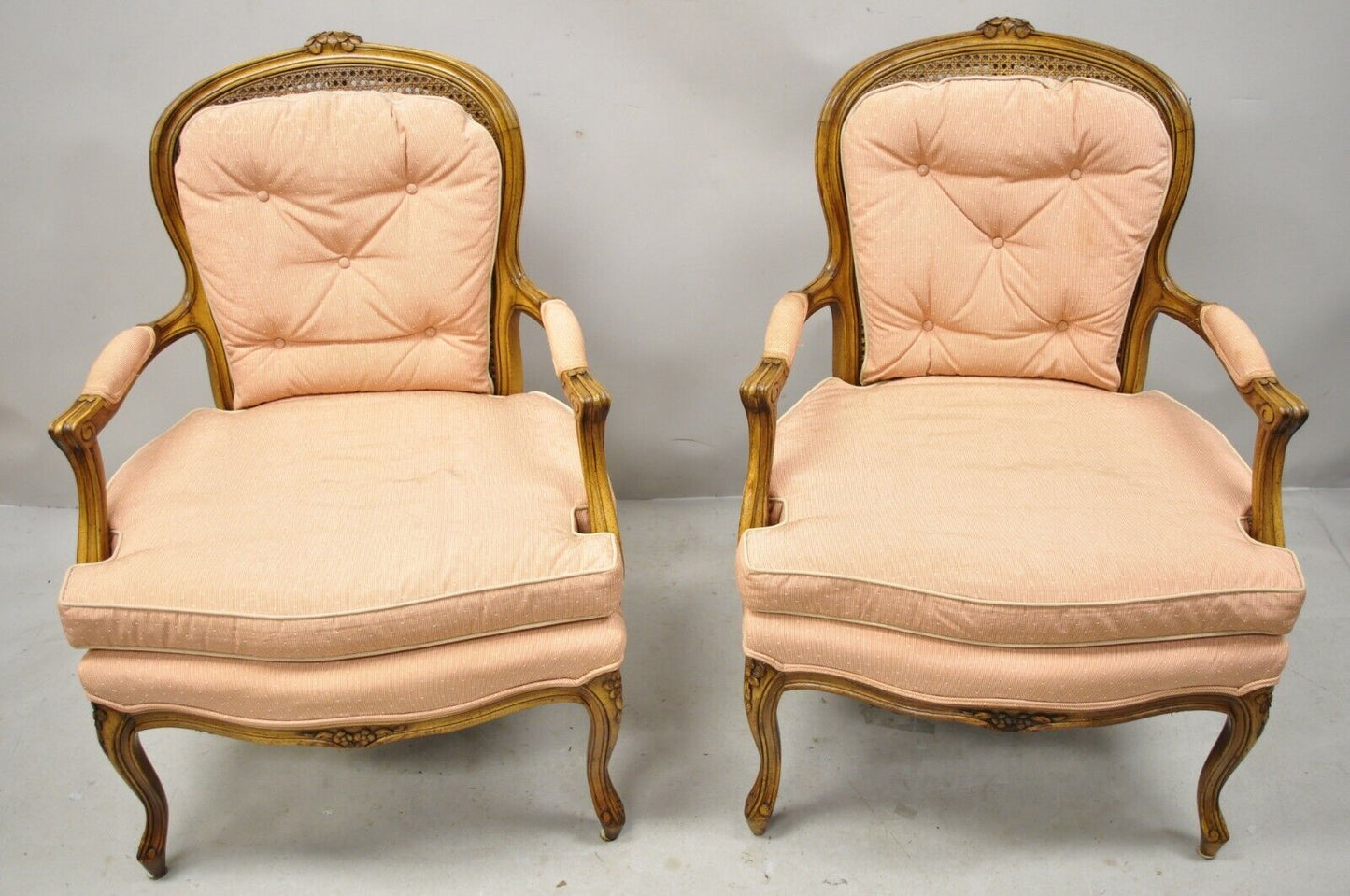 French Louis XV Provincial Style Carved Walnut Cane Back Arm Chairs - a Pair
