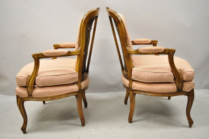 French Louis XV Provincial Style Carved Walnut Cane Back Arm Chairs - a Pair