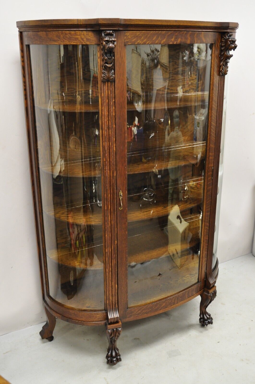 Antique American Empire Oak Carved Lion Head Paw Feet Bowed Glass China Cabinet